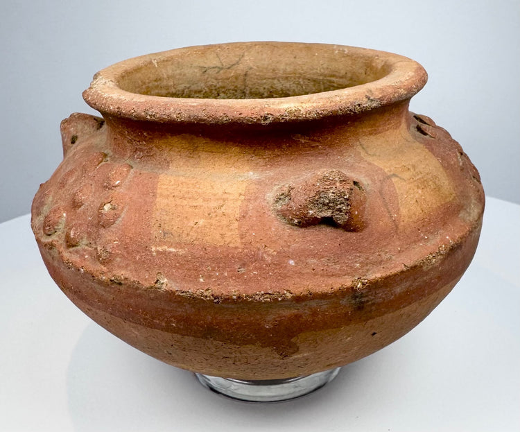 Historic Pre-Columbian pottery artifact with sculpted clusters, textured decoration, and centuries-old surface wear.