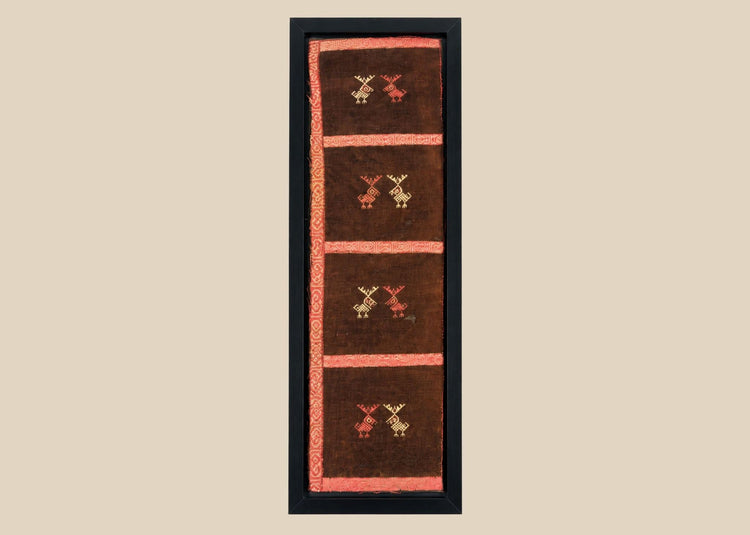 Pre-Columbian Andean textile fragment with geometric animal embroidery in red and cream on dark brown cotton
