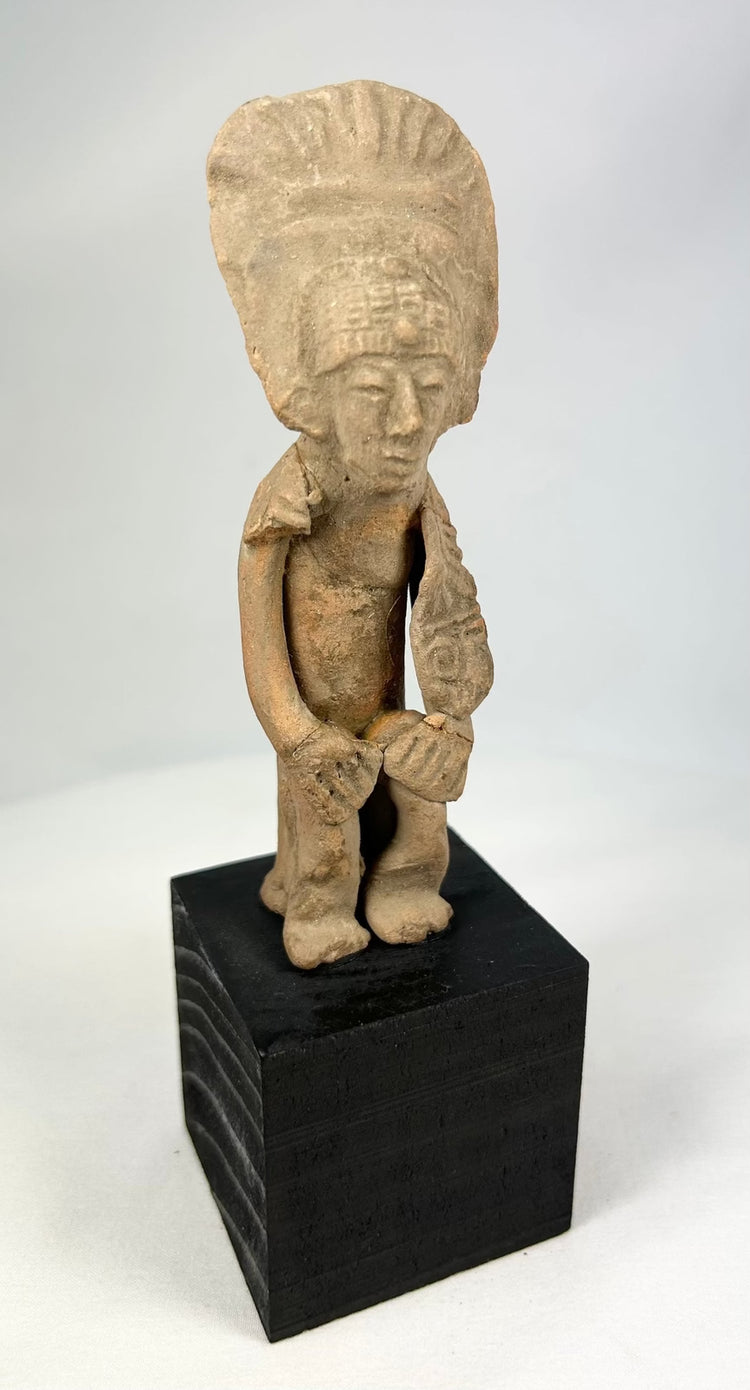 West Mexican terracotta ritual figure with geometric details and mineral deposits