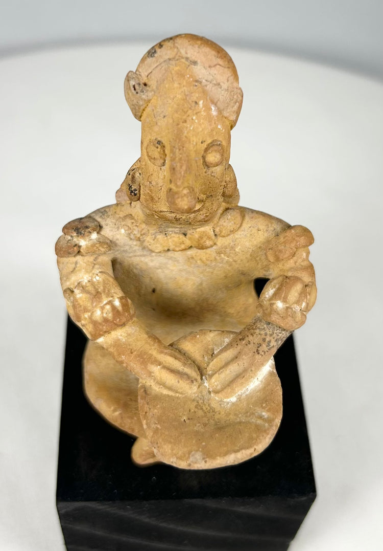 Pre-Columbian West Mexico shaft tomb terracotta figure seated with drum, displaying detailed cultural craftsmanship