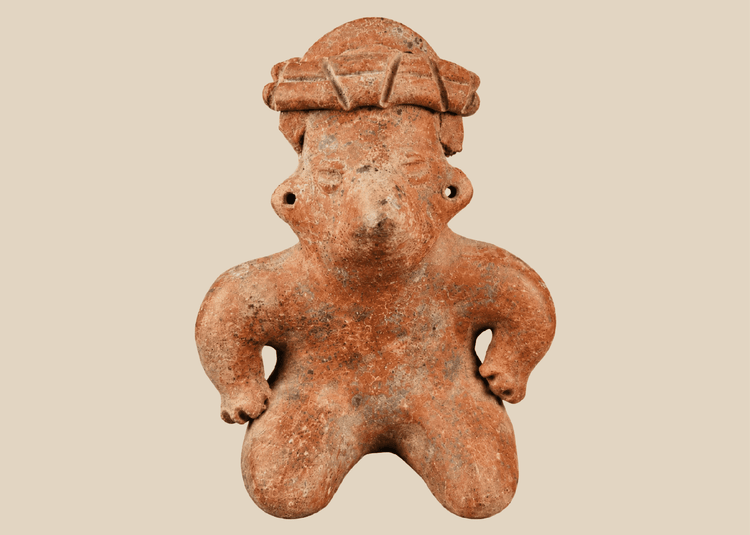 Pre-Columbian West Mexico terracotta figure with headdress on museum stand