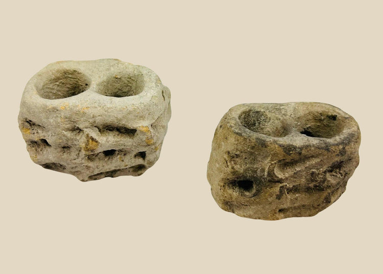 Ancient Pre-Columbian ceramic candelero vessel from Teotihuacan, Central Mexico, hand-modeled in sand-based clay with two circular openings, likely used as a brazier for incense or offerings, photographed on a white background.