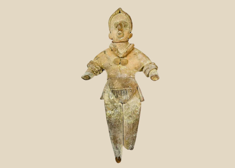 Ancient Pre-Columbian terracotta figurine, circa 300–900 CE, depicting a stylized human figure with detailed jewelry and headdress, shown standing with arms extended.