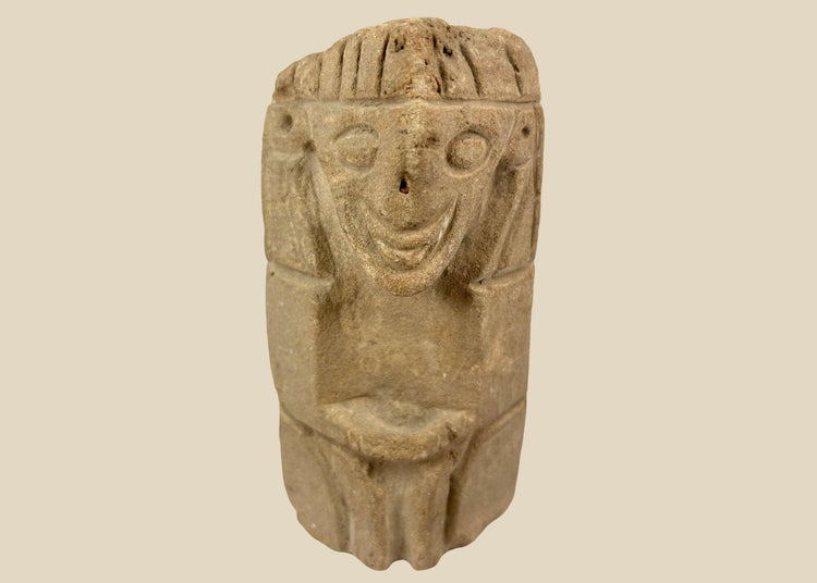 Pre-Columbian carved stone idol from West Mexico or Andean Highlands, circa 500–1000 CE, hand-carved volcanic stone or sandstone, stylized anthropomorphic features with almond-shaped eyes and geometric body, compact ritual or domestic shrine figure