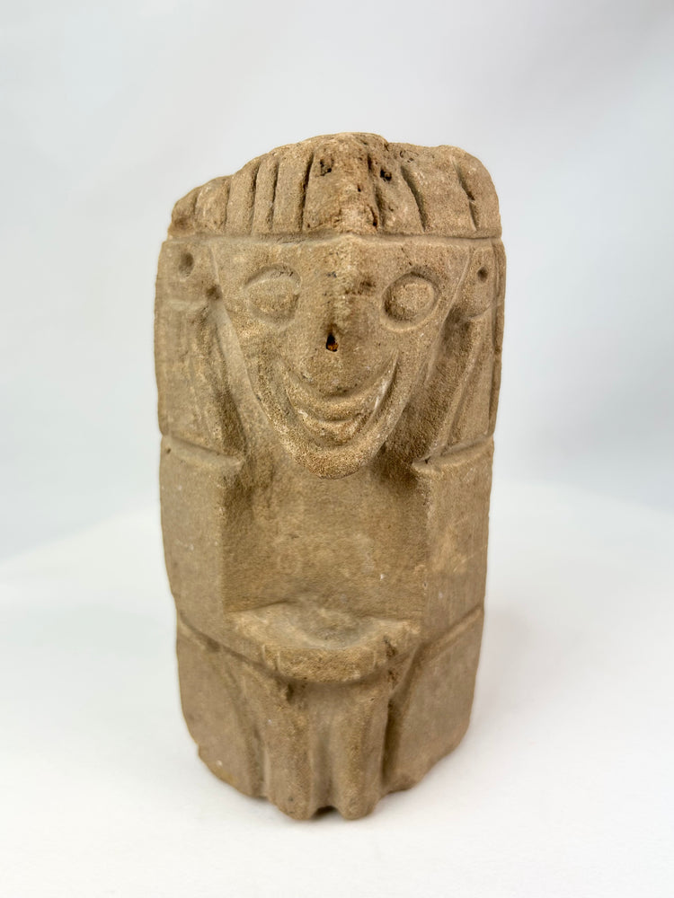 Pre-Columbian carved stone idol from West Mexico or Andean Highlands, circa 500–1000 CE, hand-carved volcanic stone or sandstone, stylized anthropomorphic features with almond-shaped eyes and geometric body, compact ritual or domestic shrine figure