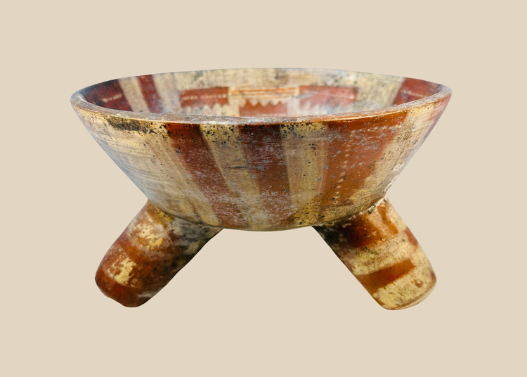 Ancient Mesoamerican tripod bowl showing archaeological surface deposits
