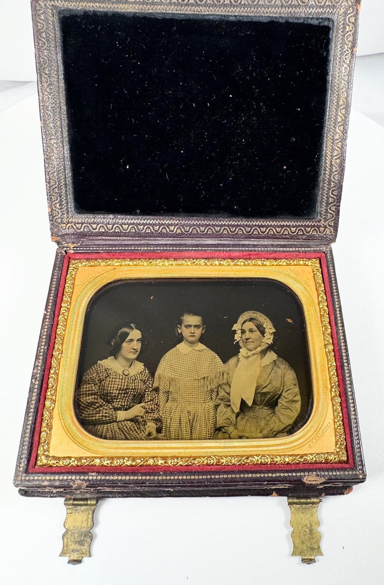 Antique Rehn ambrotype showing three female figures in a formal studio portrait