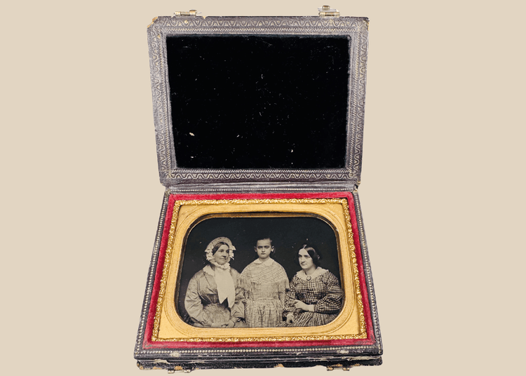 Quarter-plate Victorian ambrotype depicting three female sitters in period dress