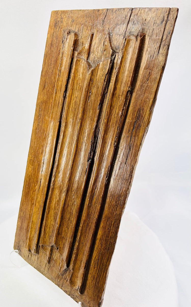 Close-up of 16th-century Gothic oak panel highlighting tooling marks and historic patina