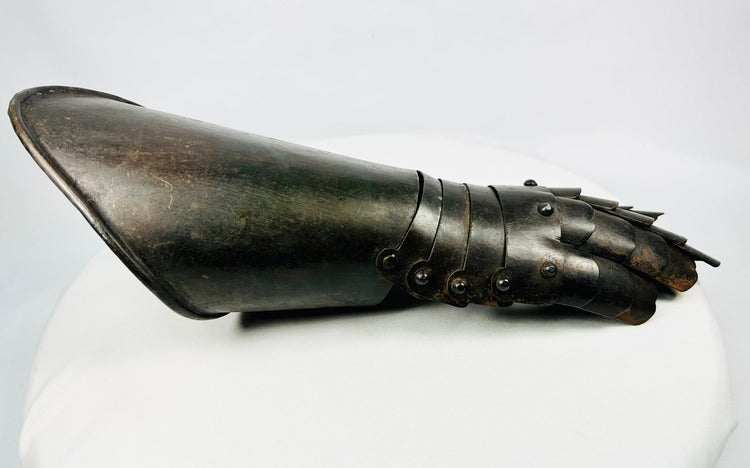 Medieval-style forged steel gauntlet, 16th–17th-century design, shown angled with articulated fingers.