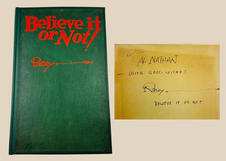 Close-up of 1929 Ripley’s Believe It or Not! signed first edition, showing author inscription and vintage green cloth hardcover.