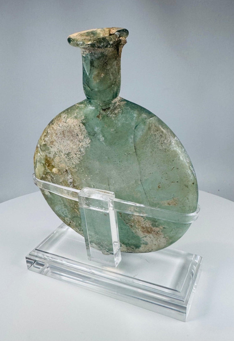 Ancient Roman pale green glass container with flared rim and custom display stand