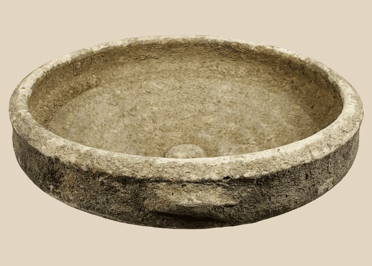 Authentic Roman North African terracotta bowl dating to the Roman Imperial Period, featuring a broad shallow form with traces of white slip.