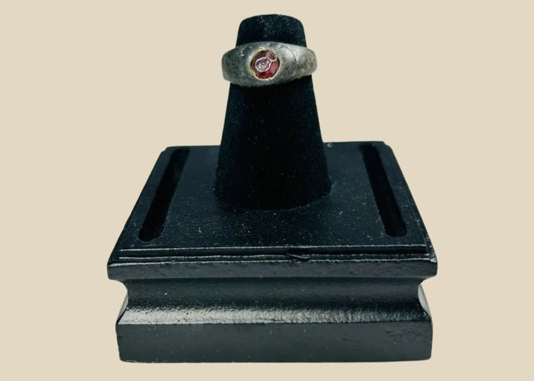 Ancient Sassanian silver ring with polished carnelian intaglio gemstone featuring engraved design, circa 224–651 CE, used as both personal adornment and functional seal.