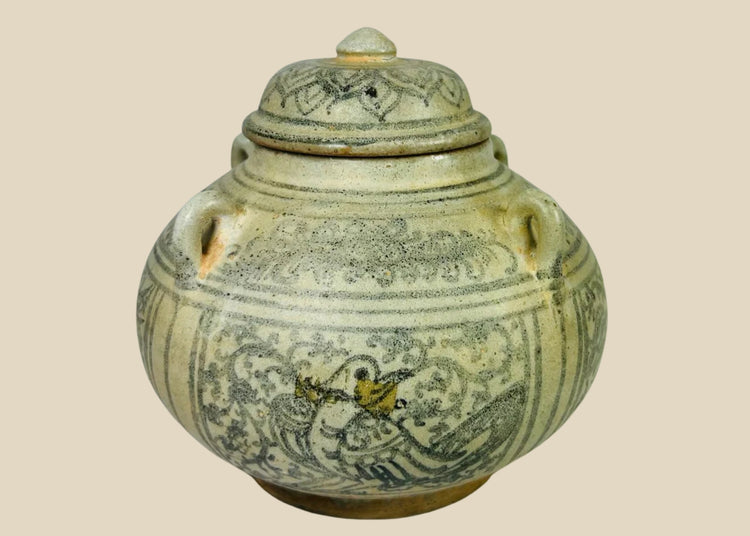 Sawankhalok glazed stoneware bowl from Thailand, 14th–16th century CE. Features dark underglaze decoration with birds, beasts, and floral motifs. Rounded form with smooth glaze, reflecting Sukhothai-era craftsmanship and Southeast Asian cultural influences. Excellent preserved condition with minor age wear.