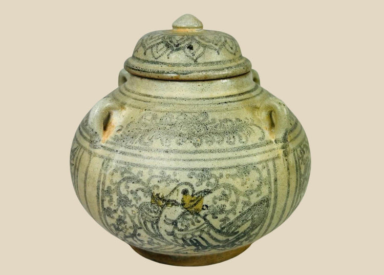 Sawankhalok glazed stoneware bowl from Thailand, 14th–16th century CE. Features dark underglaze decoration with birds, beasts, and floral motifs. Rounded form with smooth glaze, reflecting Sukhothai-era craftsmanship and Southeast Asian cultural influences. Excellent preserved condition with minor age wear.