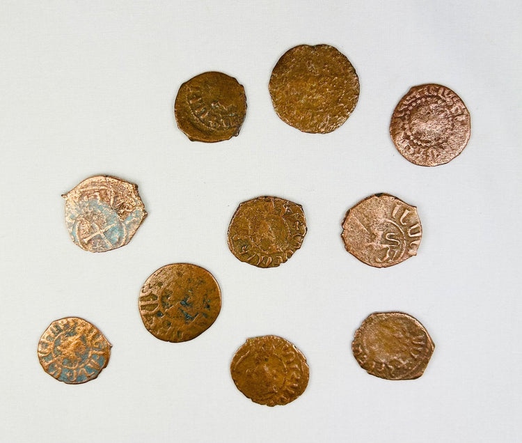 Authentic Crusader States bronze coin group showing hand-struck Christian symbols, irregular flans, and ancient green-brown patina.