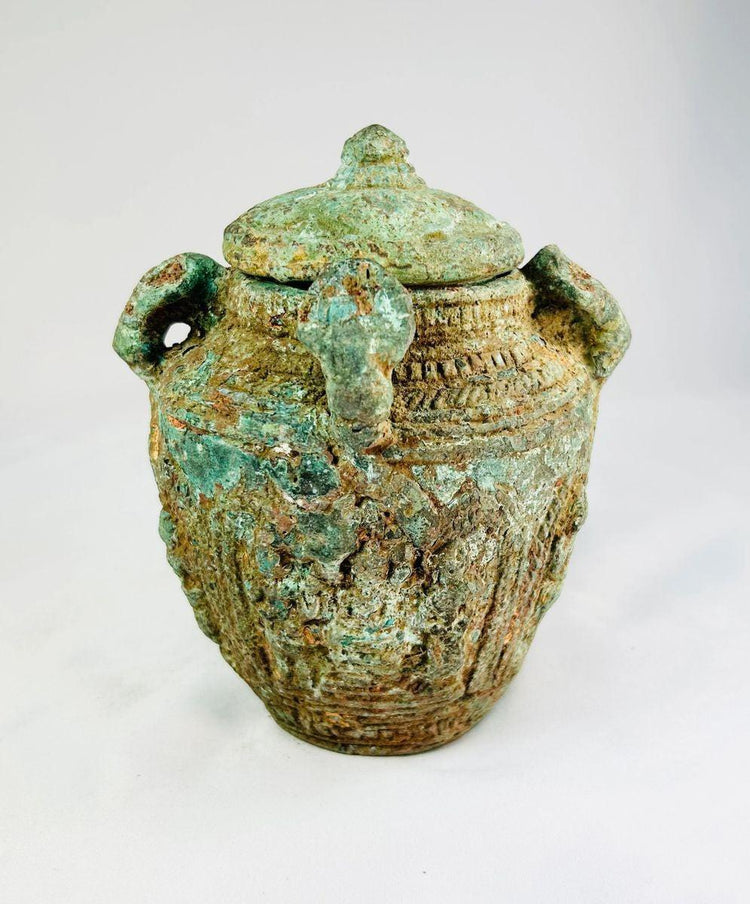 Shang–Zhou Dynasty bronze vessel, four-handled lidded jar with decorative relief patterns and aged patina, ancient Chinese ritual artifact.