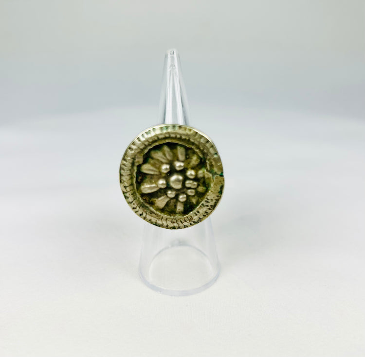 Late 19th century European silver-toned ring with raised rosette floral motif, beaded border, and tapered band, antique Victorian-era jewelry piece