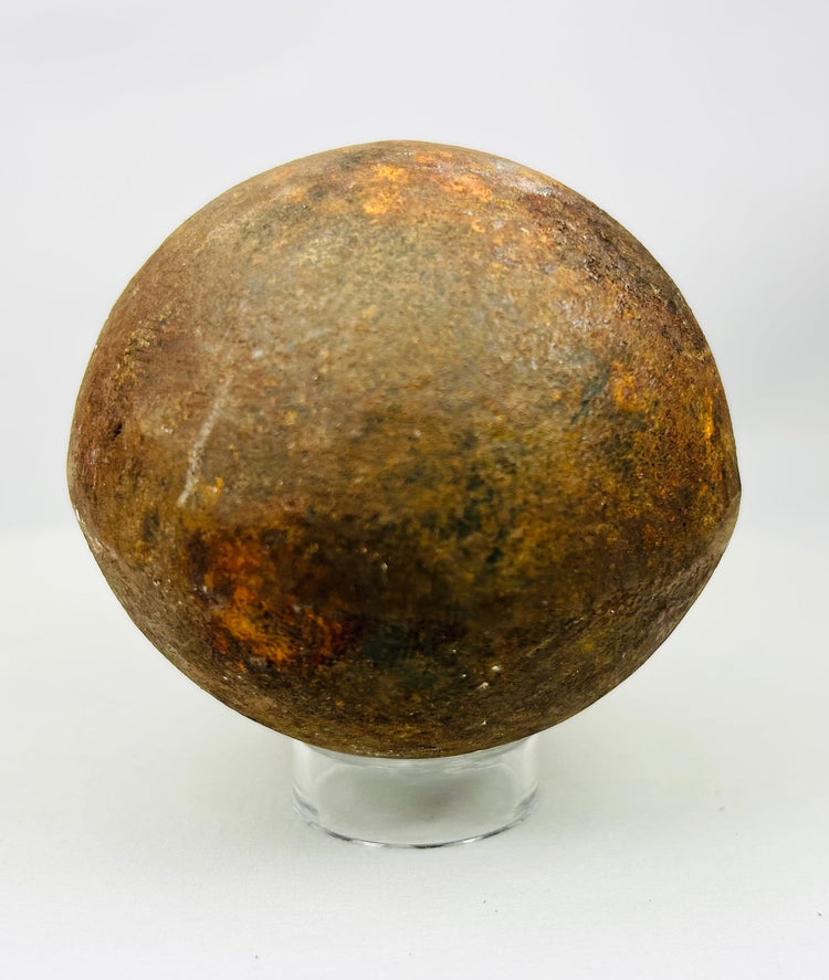 18th–19th century iron cannonball with stabilized oxidation and deep surface patina