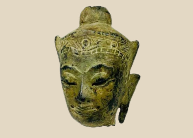 Fragmentary cast bronze Buddha head with serene expression, arched brows, closed eyes, subtle smile, and engraved crown band; traces of gilt and lacquer; likely Thailand or Burma, Late Ayutthaya–Early Rattanakosin or Toungoo–Konbaung period, circa 15th–18th century CE; mounted on a custom acrylic stand.