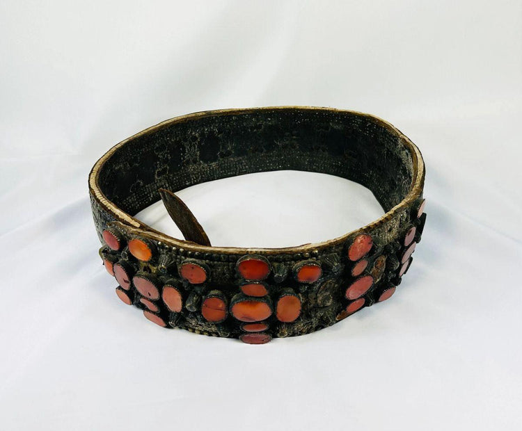Side view of a 17th–18th century Southern Russian Jewish bridal belt made of brass and set with polished carnelian gemstones, showing intricate craftsmanship and aged patina.