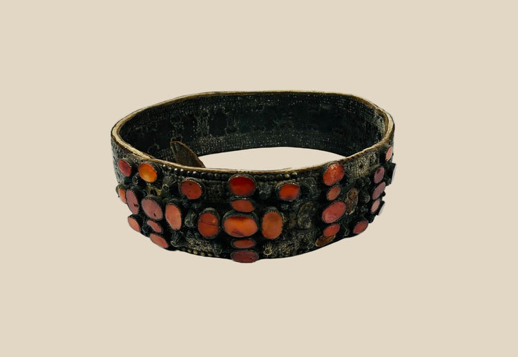 Ornate Southern Russian bridal belt, 17th–18th century, crafted with riveted brass plates and inlaid with vibrant Cornelian stones, used in Jewish wedding ceremonies.