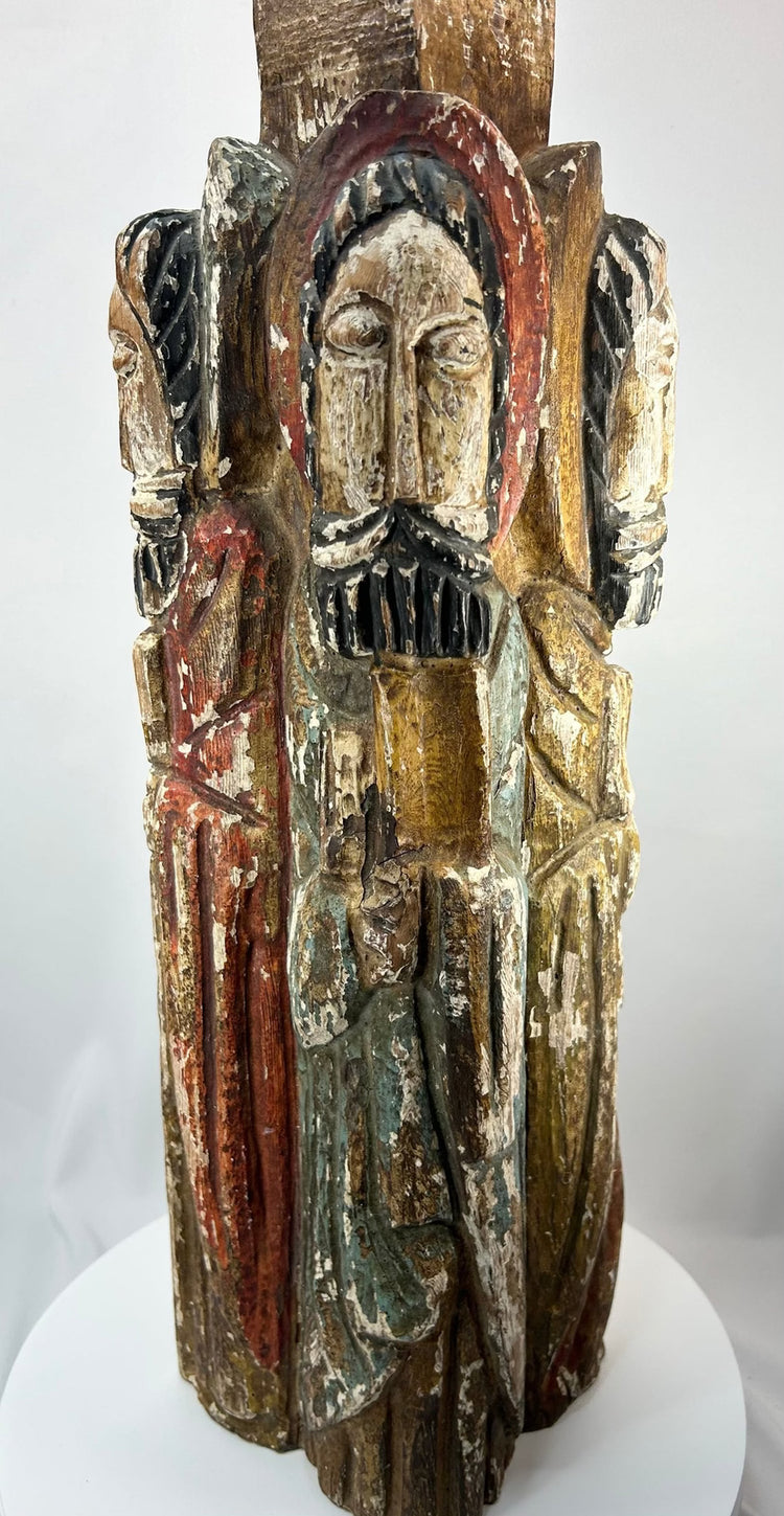 Antique Spanish Colonial devotional sculpture with four carved saints arranged around a column.