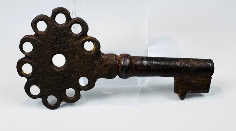 16th–18th century Spanish iron key showing a pierced handle, compact bit, and naturally developed antique patina.