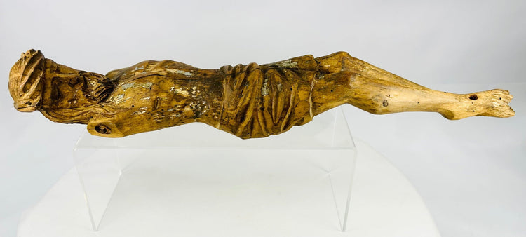 Early Colonial wooden religious figure with defined torso carving and surviving painted surface traces