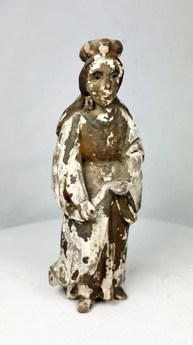 Antique Spanish Colonial Santo statue, hand-carved from wood with remnants of polychrome paint, depicting a robed religious figure with folded hands, traditional hairstyle, and worn surface patina, dating to the 18th–19th century, used for devotional practices in colonial-era Catholic households.
