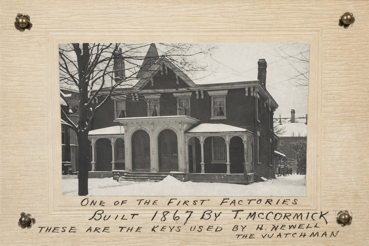 Historic 1867 factory photograph by T. McCormick mounted on card, with handwritten note referencing keys used by watchman H. Newell, displayed