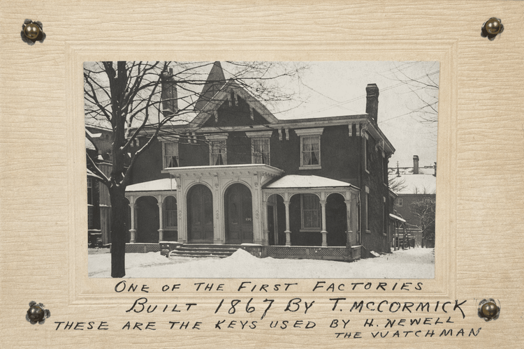 Historic 1867 factory photograph by T. McCormick mounted on card, with handwritten note referencing keys used by watchman H. Newell, displayed