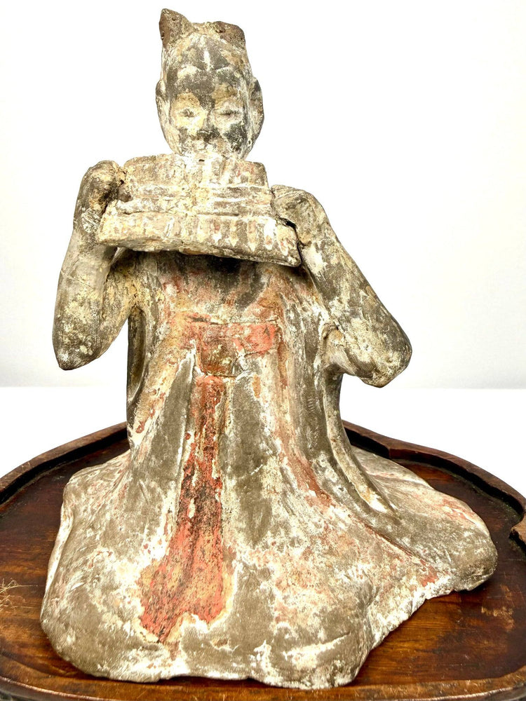 Ancient Chinese terracotta figurine seated woman playing pan flute detail