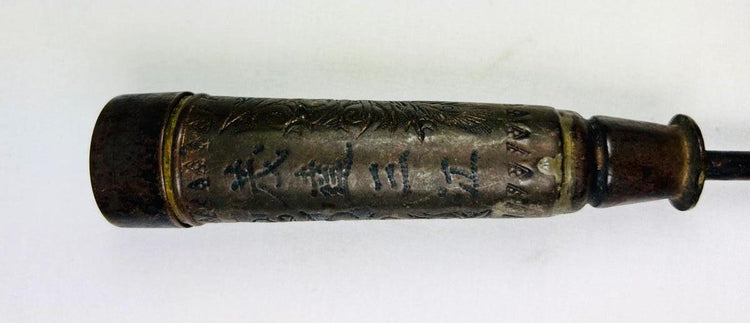 Antique Chinese temple candle holder from the Late Qing Dynasty (circa 1850–1911), cylindrical bronze form with engraved Chinese inscriptions and decorative motifs, mounted on a tapered base; patinated surface with signs of ritual use, once employed in Buddhist or Daoist temple settings as part of ceremonial altar furnishings.