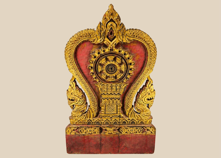 Front view of late 19th century Thai Dharmachakra shrine panel with Naga serpents