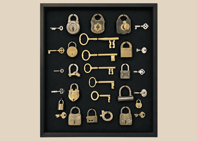 Antique lock and key collection in shadow box frame featuring 15 vintage padlocks and skeleton keys from the 19th century