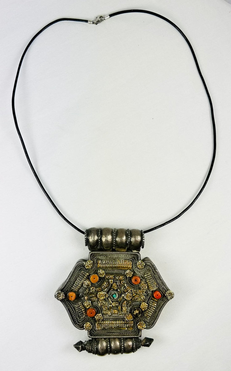 Tibetan-Nepalese gau amulet pendant with coral, turquoise, and hollow reliquary cavity