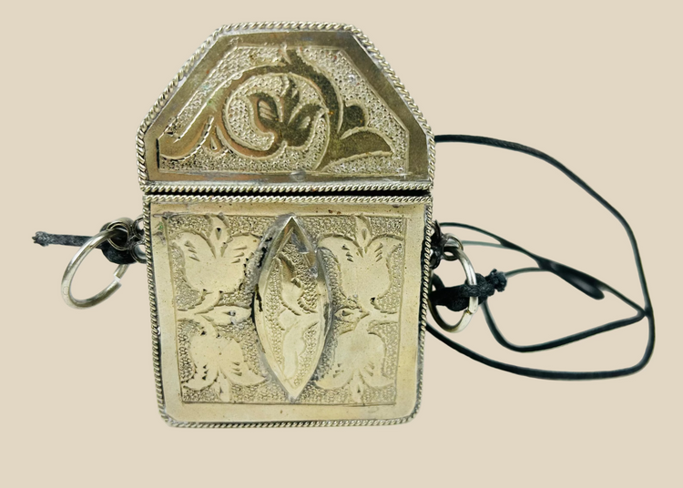 19th century Tibetan silver repoussé gau amulet box, hinged portable shrine with floral and symbolic motifs, original leather strap remnants, Himalayan devotional artifact