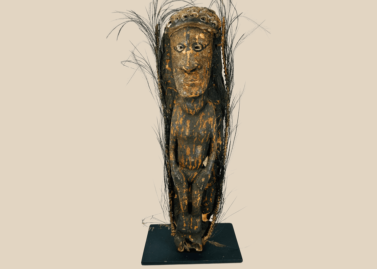 Sepik River Papua New Guinea ancestor figure with shell eyes and feather adornments