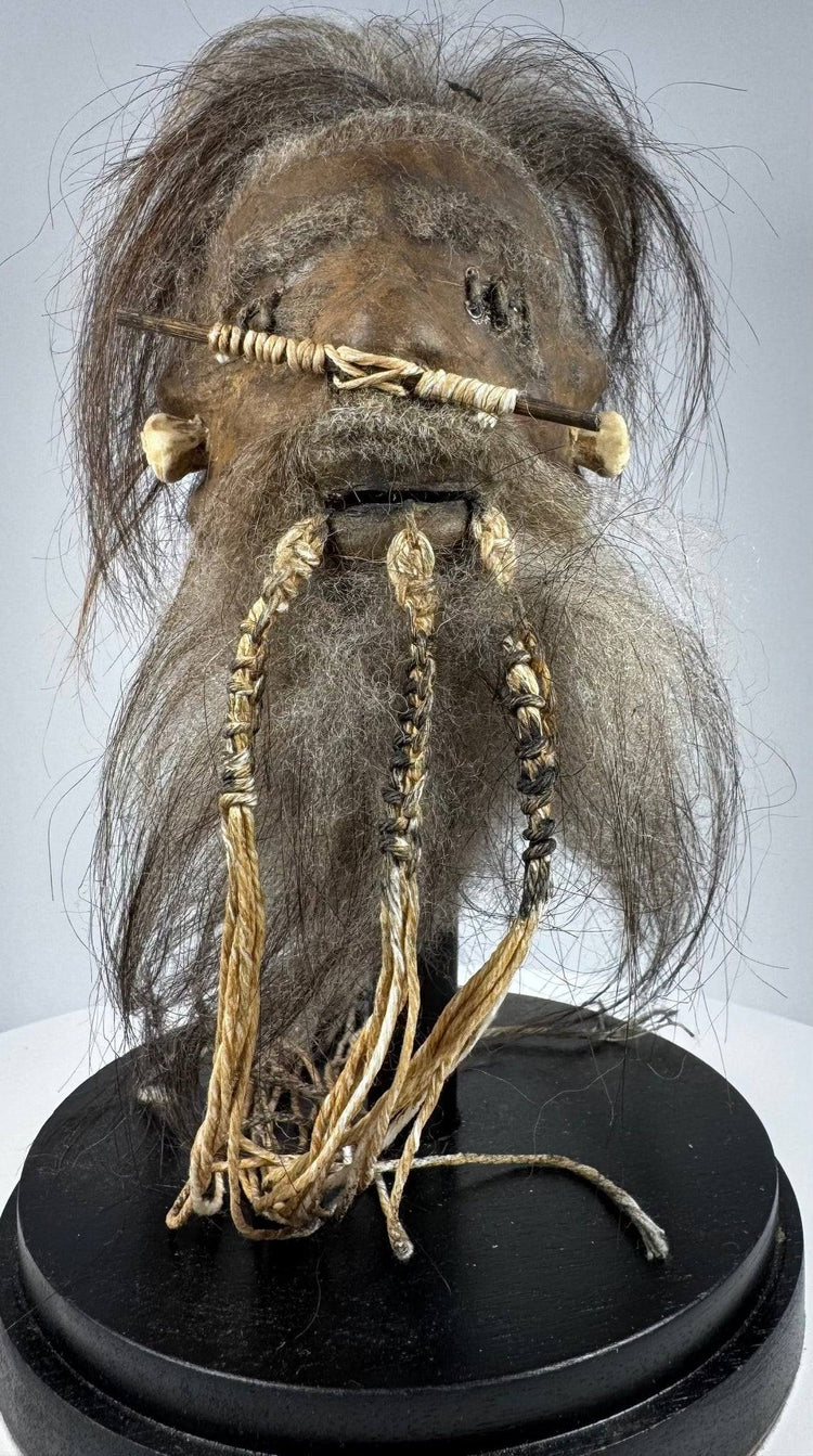 1950s–1960s tsantsa-style curiosity crafted from animal hide, with detailed facial stitching and long dark horse hair.