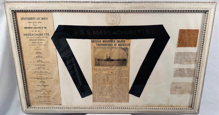 Spanish-American War era battleship memorabilia display centered around a USS Massachusetts ribbon