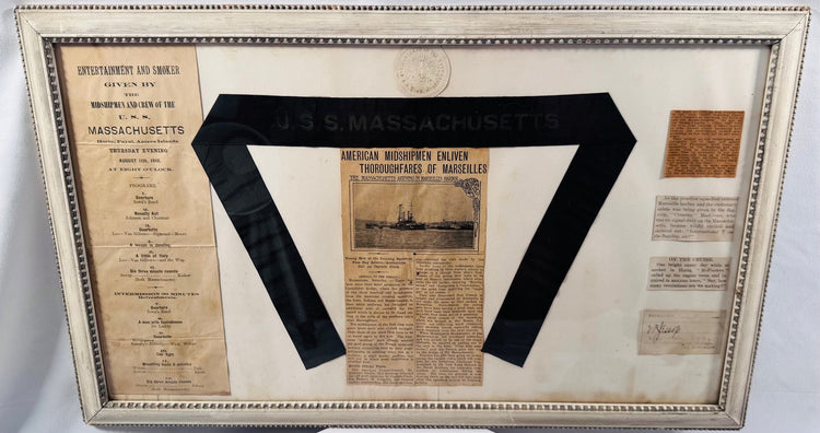 Spanish-American War era battleship memorabilia display centered around a USS Massachusetts ribbon