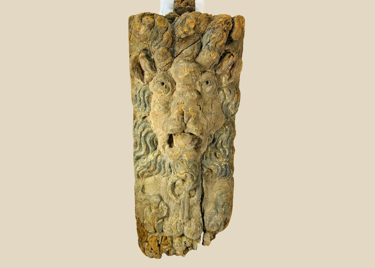Hand-carved hardwood Baroque lion mascaron corbel with swirling mane, traces of original blue-grey paint, gesso, and parcel gilding, integral tenon and fixing holes for architectural mounting, late 17th–early 18th century, Europe, circa 1650–1750.