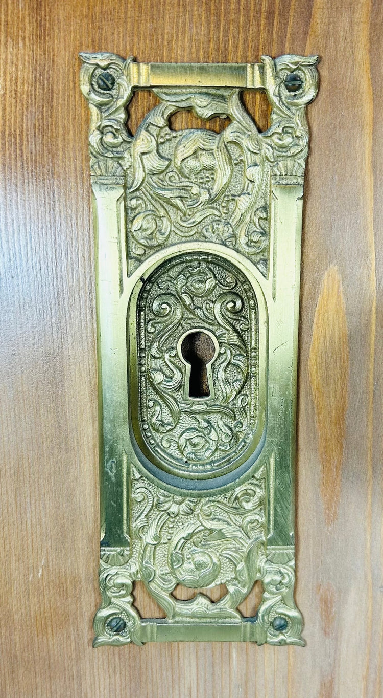 Antique door hardware board with cast brass components and original key