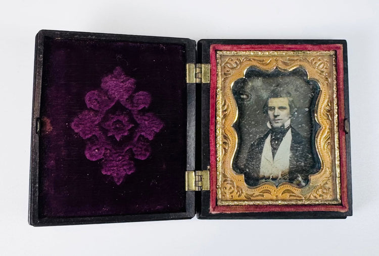 Mid-19th century daguerreotype portrait featuring a well-dressed Victorian gentleman