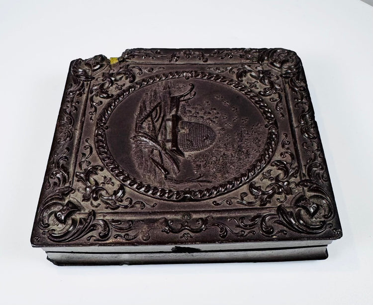 Collectible 19th century daguerreotype photographs with beehive motif Union case