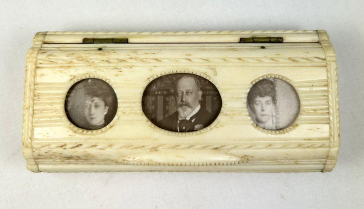 Mid 19th century bone snuff box with inset family portraits and decorative carved lid