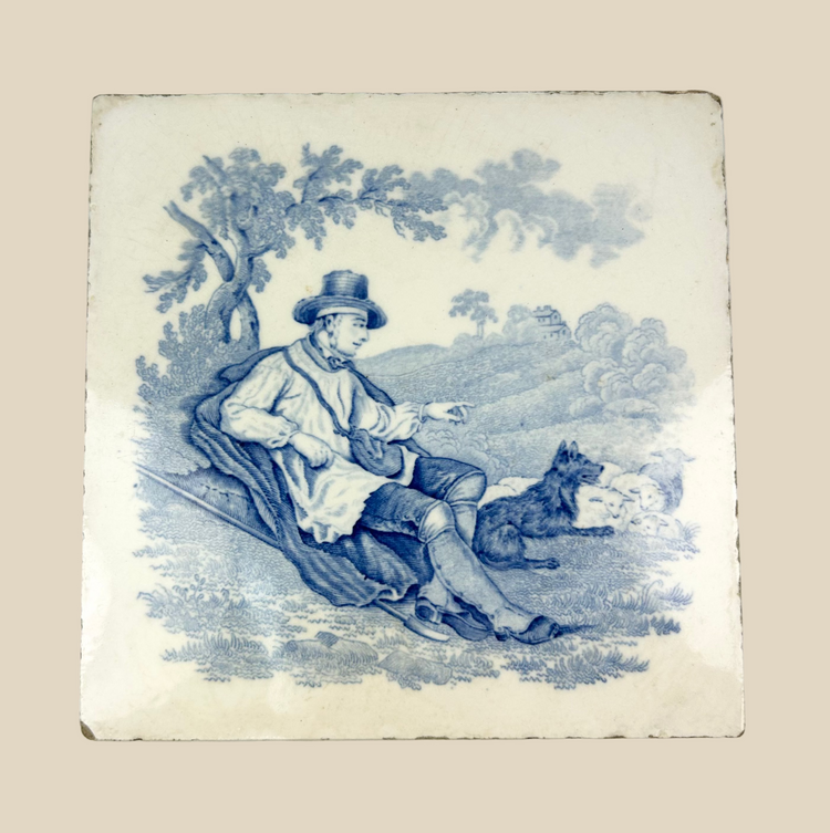 Late 19th century Staffordshire Minton glazed earthenware tile, cobalt blue transfer-printed pastoral scene of seated shepherd with sheep under tree, Victorian decorative ceramic