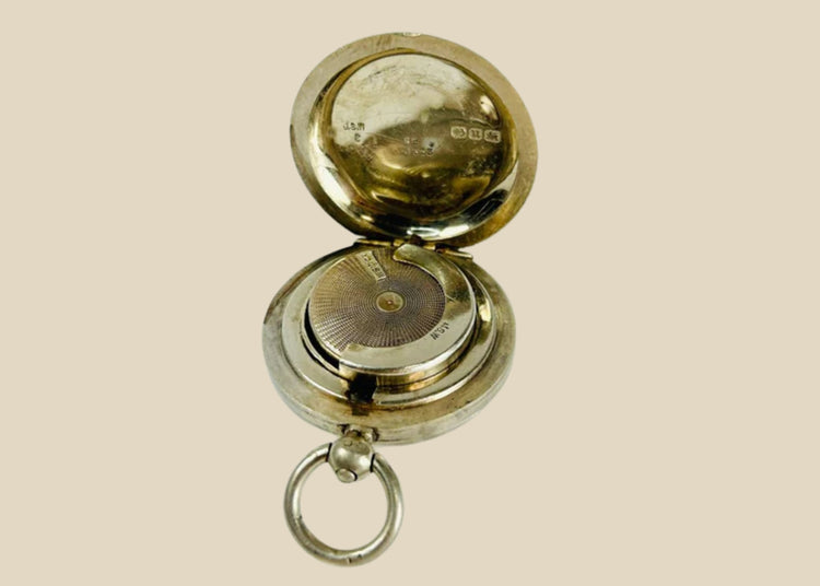 Victorian-era sterling silver sovereign holder with engraved monogram and spring-loaded mechanism, circa 1880s, United Kingdom. Compact and elegantly crafted for securely holding sovereign coins. Reflects 19th-century silverwork craftsmanship, utility, and personalized luxury accessories.